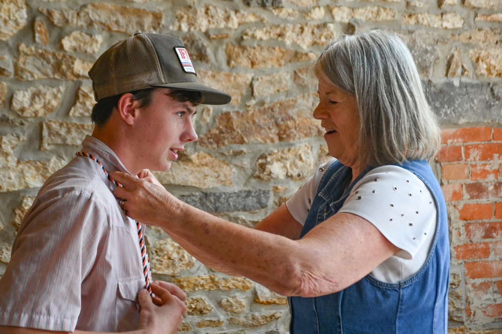 student receiving honor cord