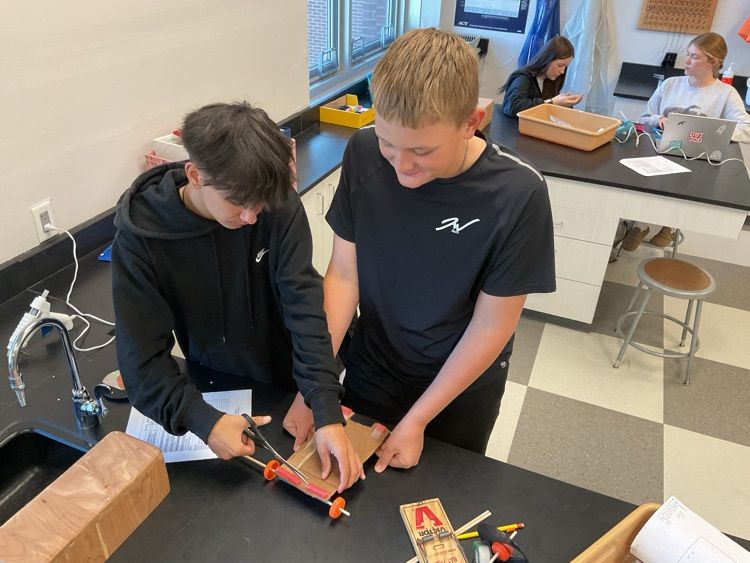 students building car