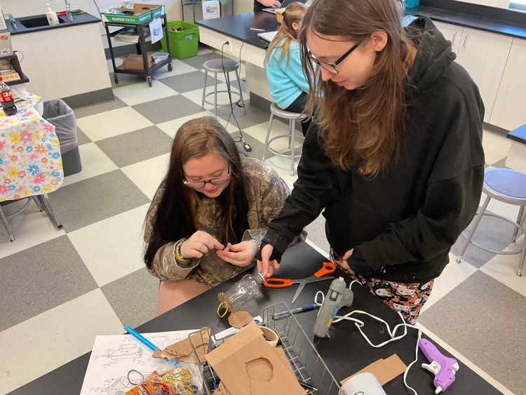 students building car