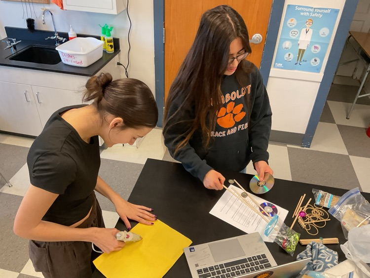 students building car