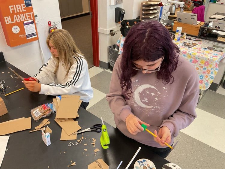 students building car