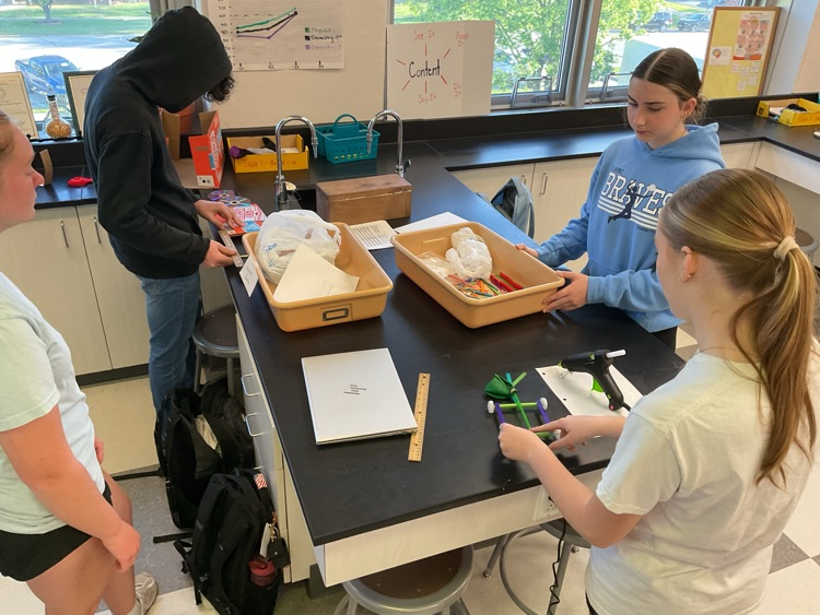 students building car