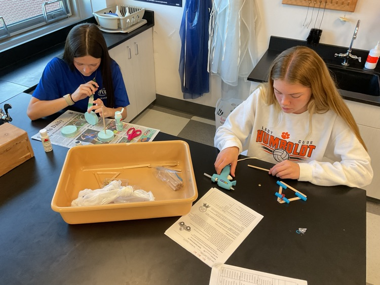 students building car