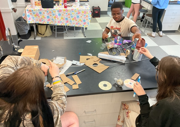 students building car