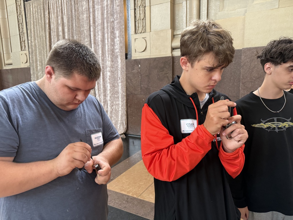 Hudson Rees and Cyler Mason attempt the lock picking station