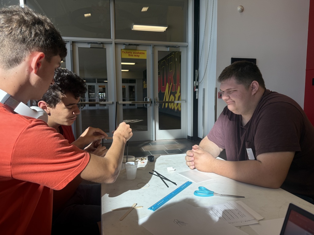 Carter Collins, Cole Megenity, and Hudson Rees work together on a structural challenge