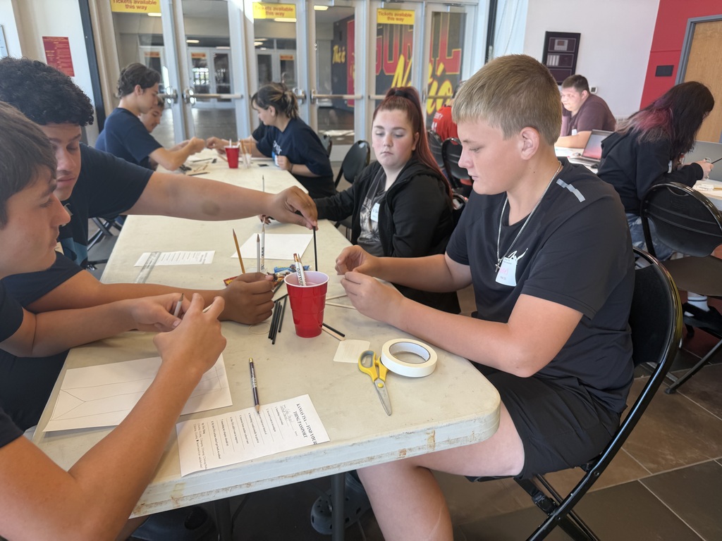 Bentley Kolb works with students from other chapters on a challenge