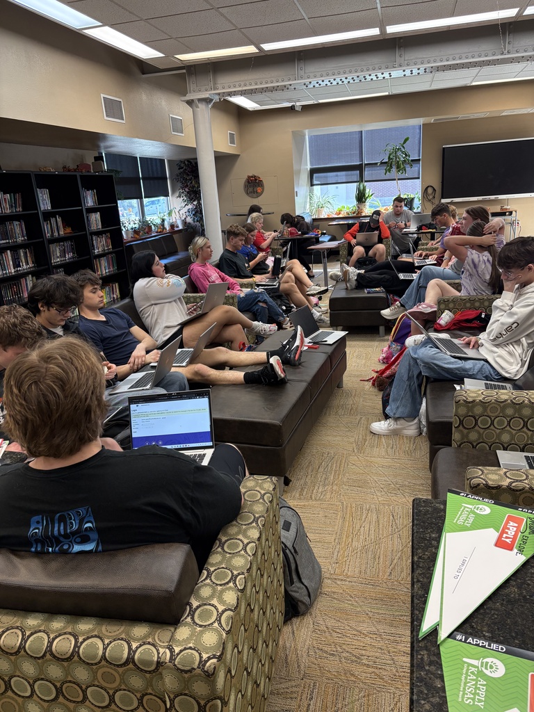 Students filling out applications 
