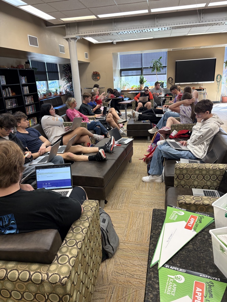 Students filling out applications 