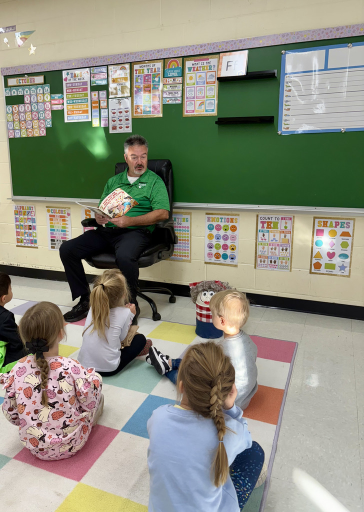 Board Member reading to preschool class