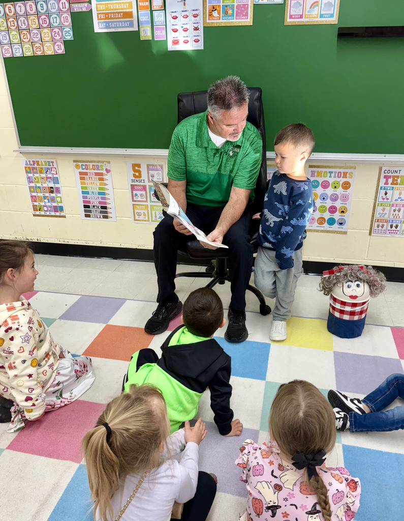 Board Member reading to preschool class