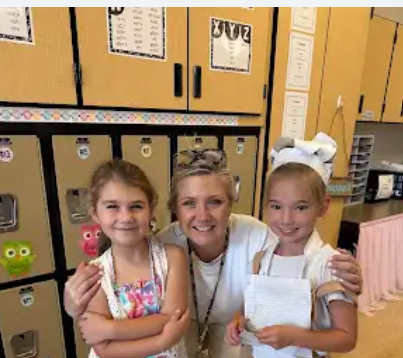 the art teacher and two students on either side that want to be artist