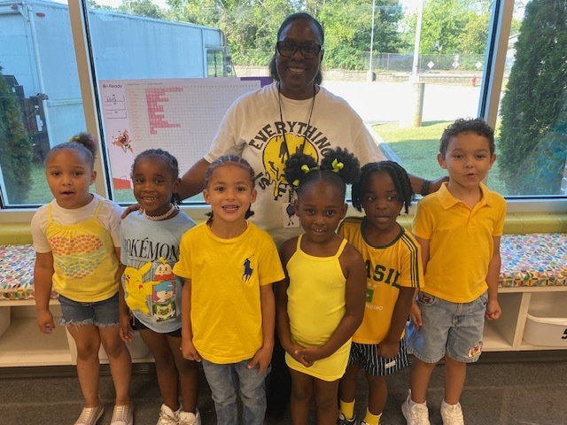Mrs. Lee and her students (Alayah Darden, Jalaya Townsend, Kiyan Hall, Ca'Layah Walton, Demetrus Jones, Ripley Hodges) wearing yellow celebrating "Colors Week"