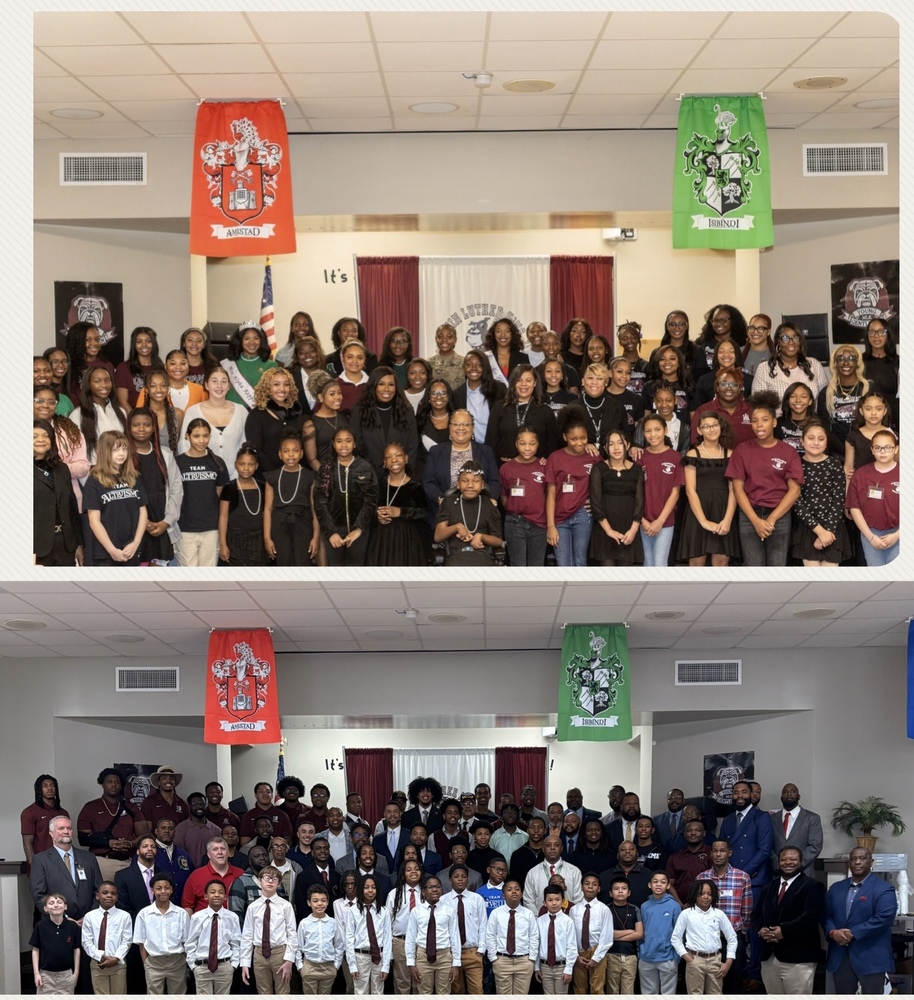 Students, mentors, teachers, volunteers standing to take a picture after event