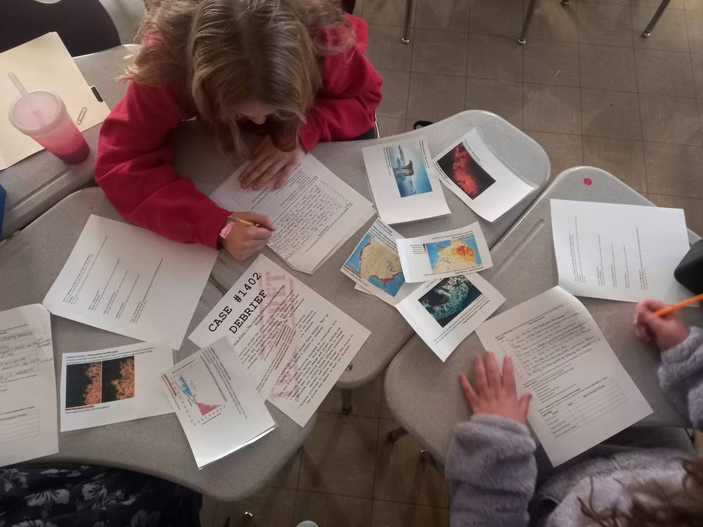 6th grade students doing a hands on investigation in science class