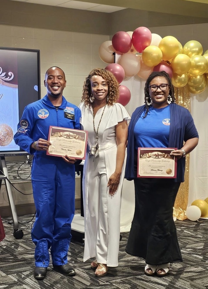 Dr. Morris standing between two Morris Elementary partners