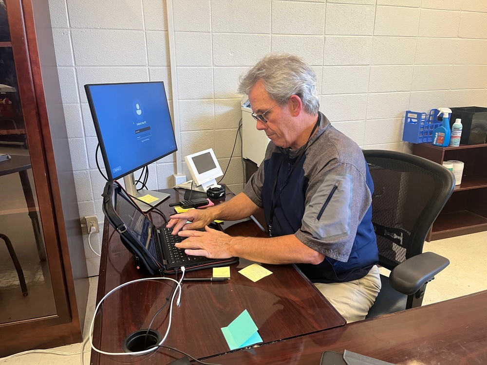 Man is typing on computer.