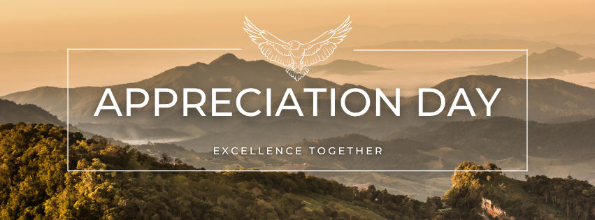 Beige and green mountains in the distance. There is a white rectangle with an eagle at the top enter and the words "aapreciation day" and "excellence together" in the center.