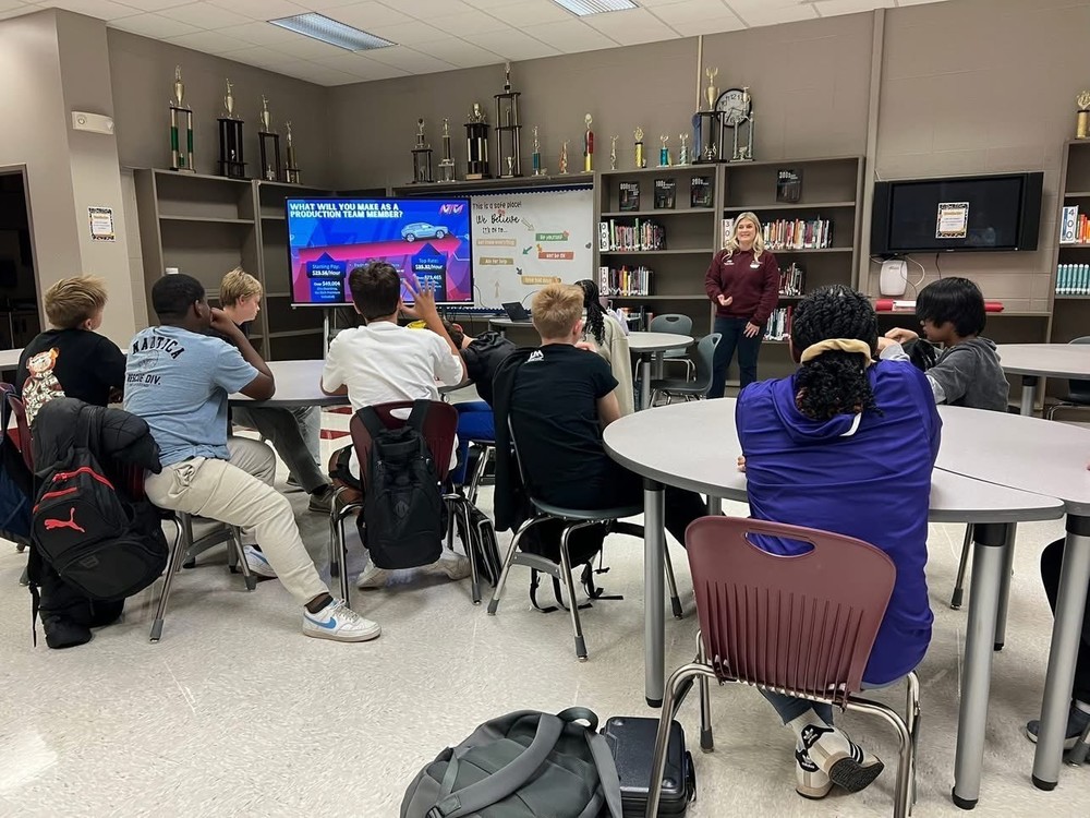 Students listening to Mrs. Anderson from Mazda Toyota
