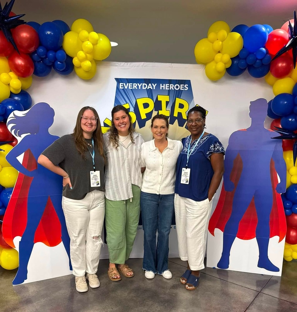 Group picture of Ms. McBride, Mrs. Buchannen, Mrs. Hill and Dr. Davis. There are balloons in the top corners framing the picture.