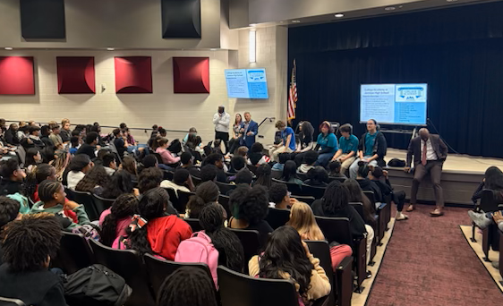Magnet high school representatives presenting their program to WMS 8th graders.