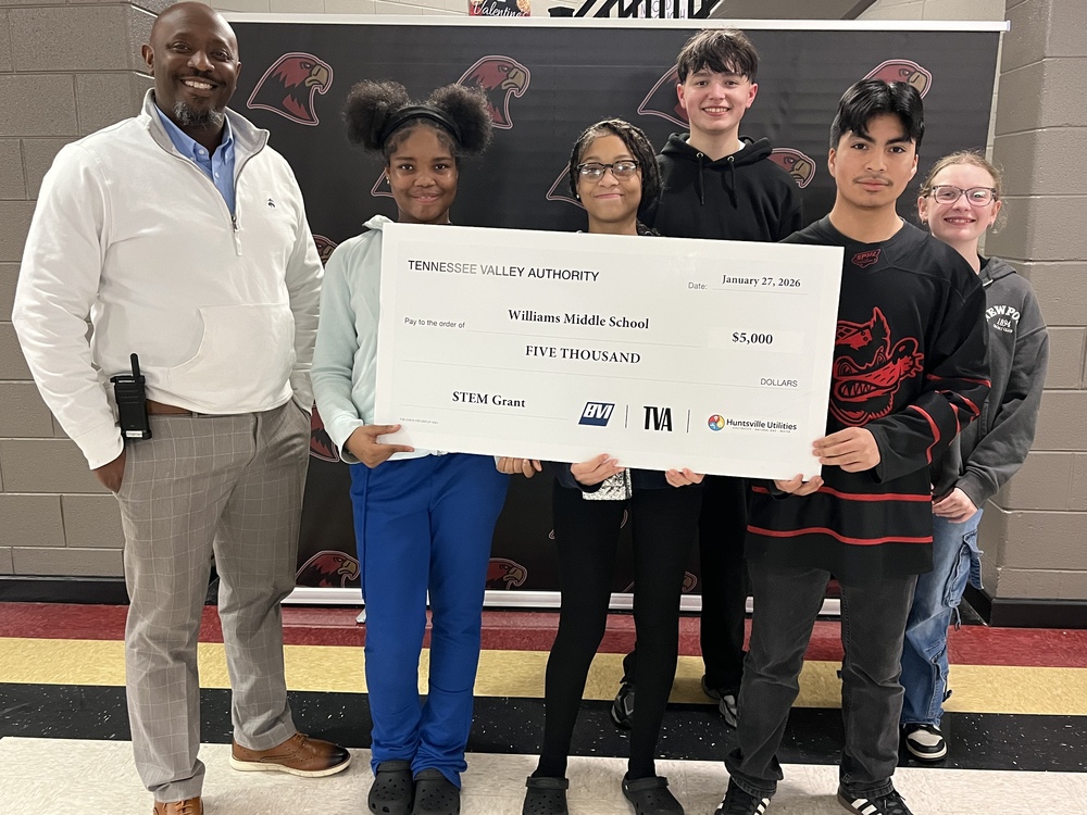 STEM students and Mr. Shipman with the grant check. 