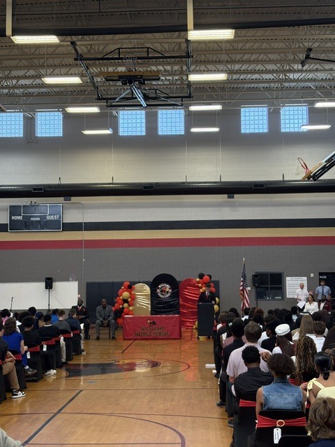 SGA Vice President Parker Horning speaking at the close of 8th grade awards and bridging ceremony.