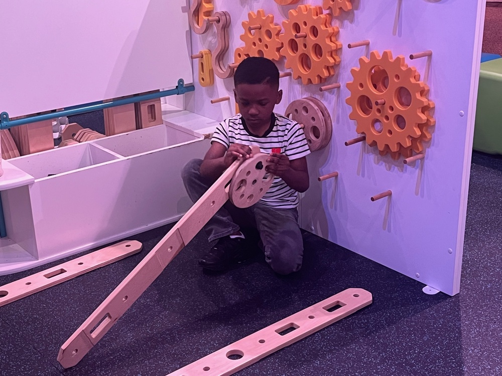 Young male students constructs a wheel.