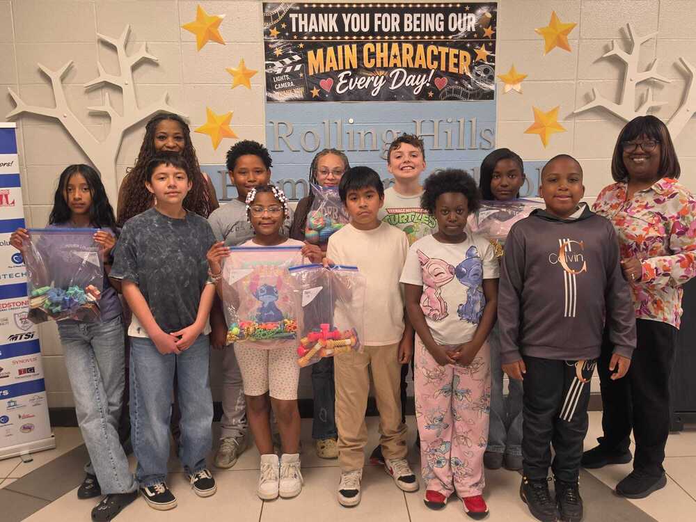 4th grade GATE students and staff pose with donated 3D-printed fidgets for children at St. Jude Hospital