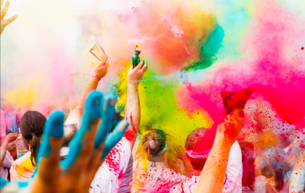 People throwing color powder in the air 