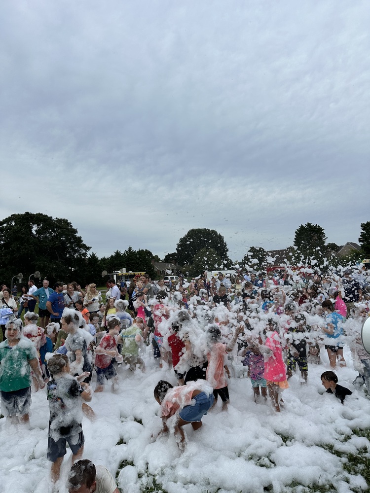 Students playing in foam at Open House