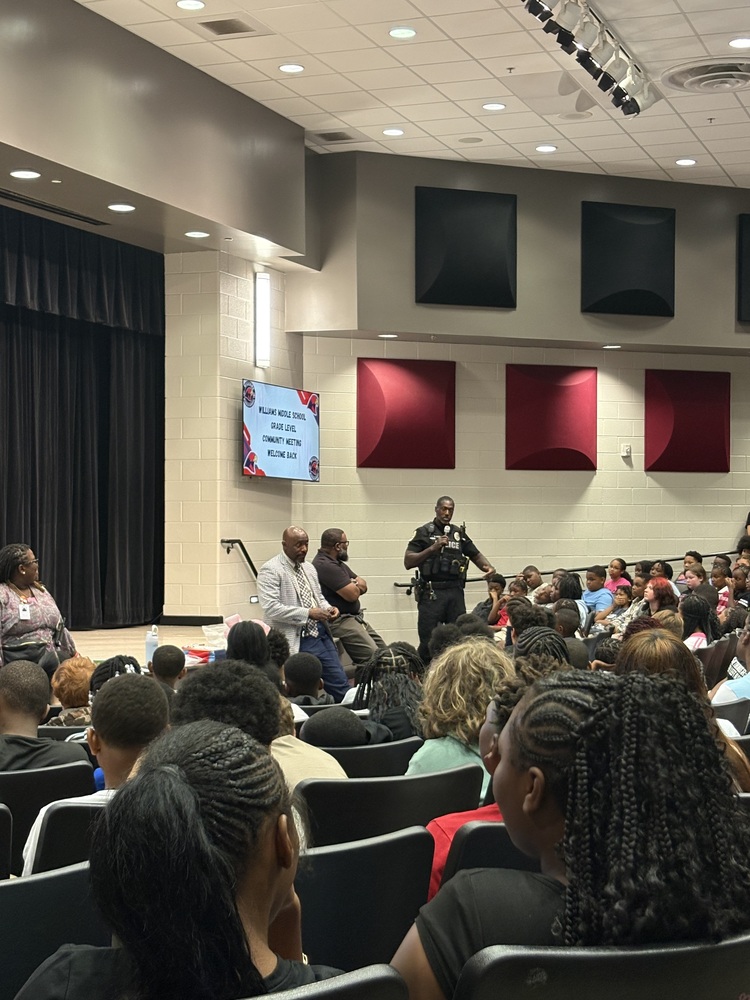 Officer Jones speaking to the 6th graders during the first grade level community meeting.