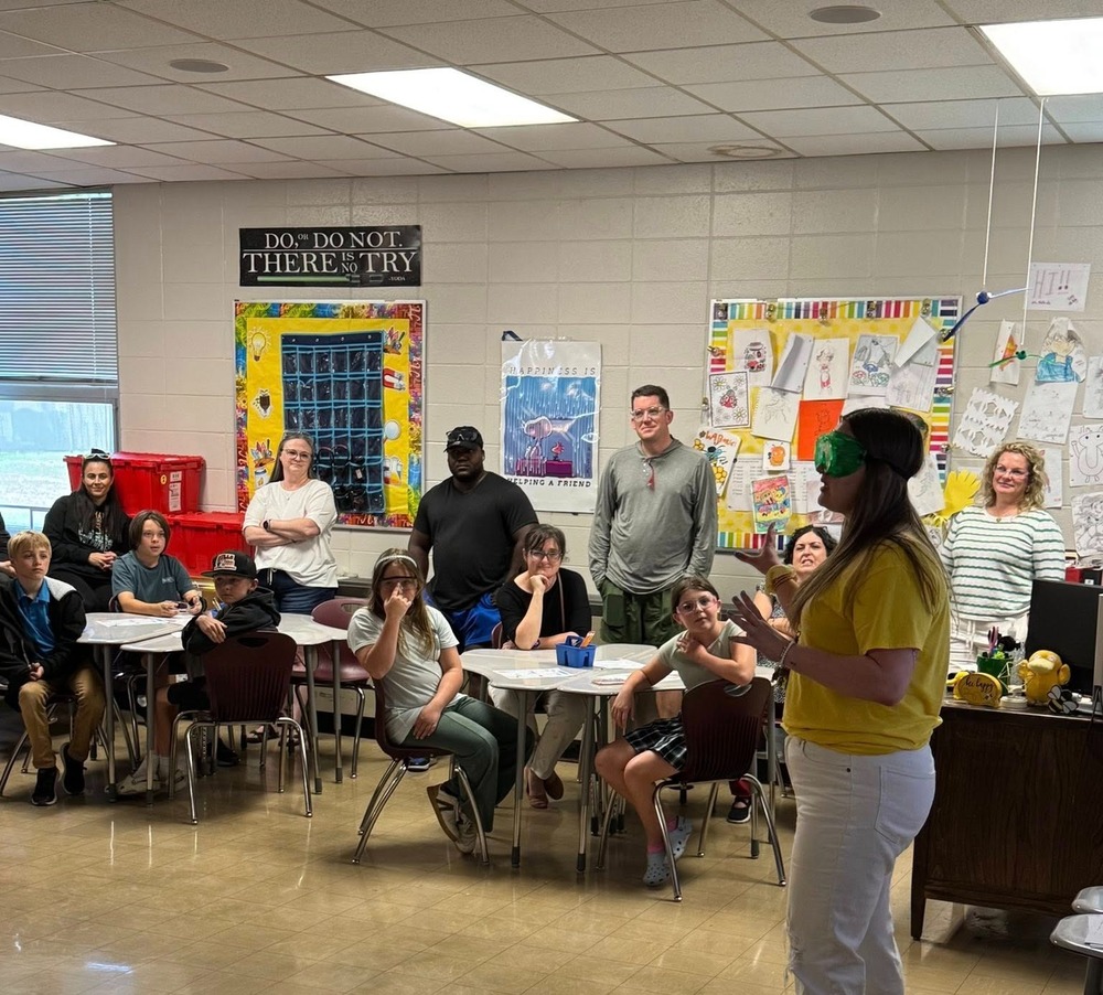 Ms. McBride giving a preview of a 6th grade science class to upcoming 6th graders