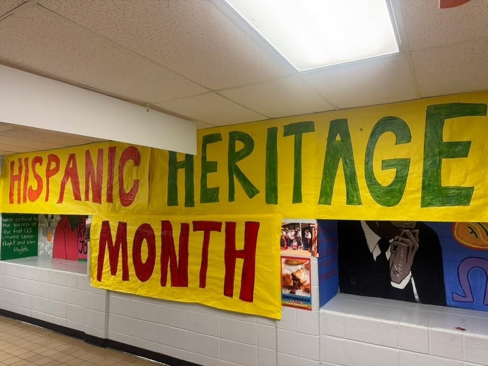 Hispanic Heritage Month banner featuring vibrant colors and cultural symbols celebrating Hispanic contributions and history.
