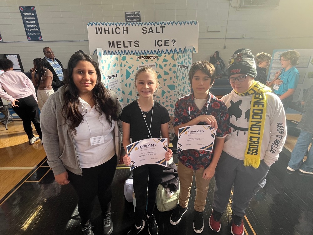 Students Liana Mercado, MacKenzie Baker, Corbin Serrano, Jackson West pose with their science fair certificates.