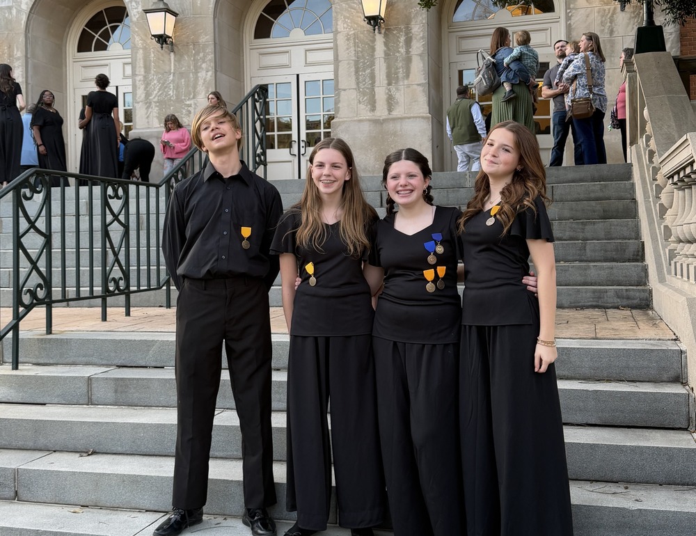 four students at the All State Choral Festival