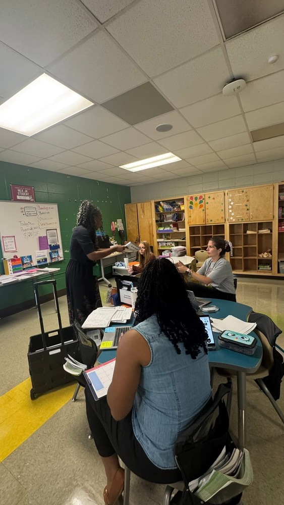 Mrs. Burrell(math coach) meeting with 2nd grade teachers