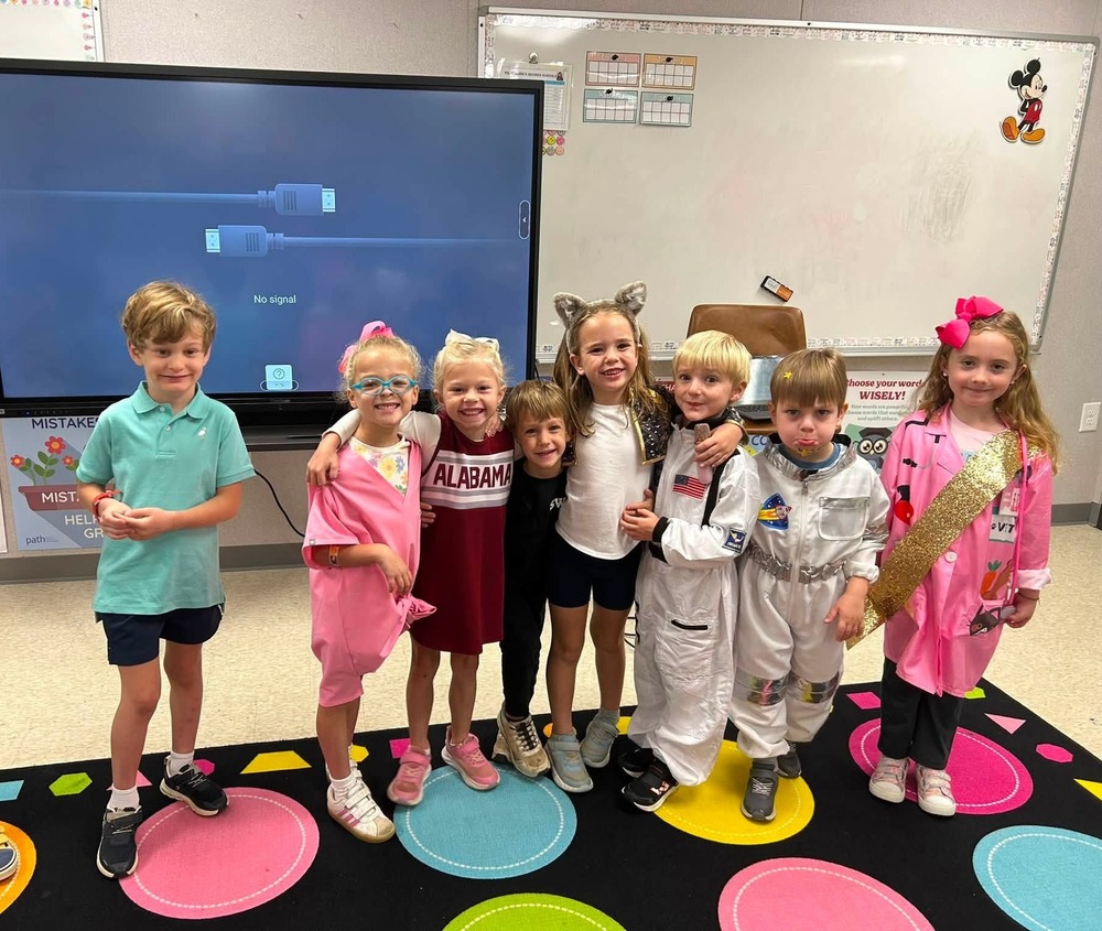 students standing dressed up in outfits as future careers such as princess, cheerleader, astronaut