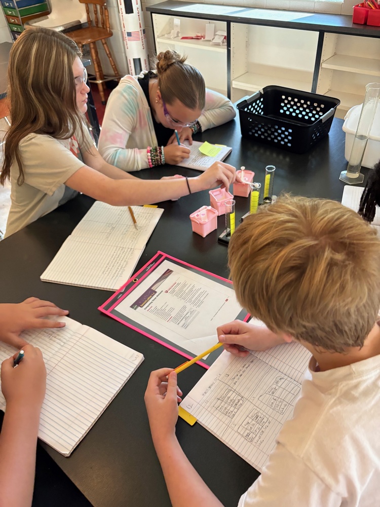 8th grade students completing an investigation on comparing mixtures