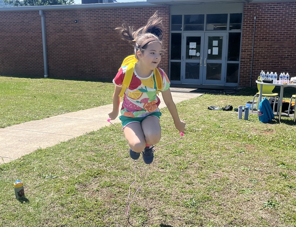 Fourth grade girl jumps rope.