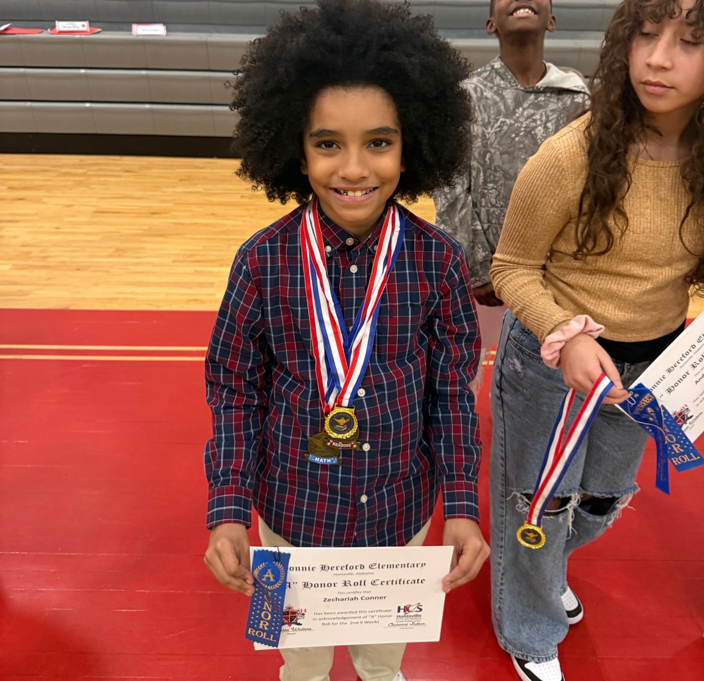 Zechariah Conner, Anadalyn Diaz , and Jermeille Townsend showing off their awards from the Wildcat Showcase