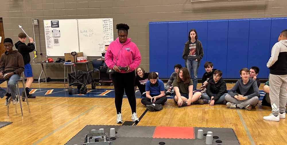 one of our students driving her robot during the robotics competition