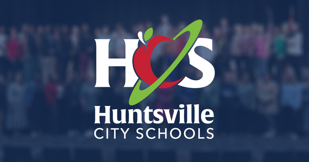 HCS logo superimposed over a blurred, dark blue overlay of people standing on stage