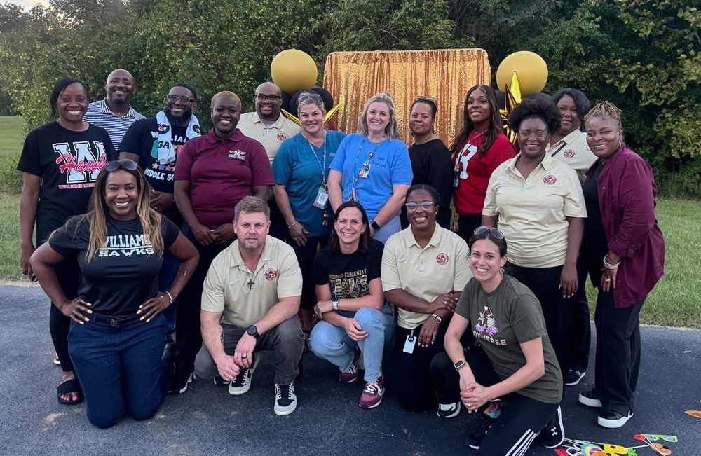 All the administrators in the Columbia High School's Feeder Pattern posing for picture at Spirit Night