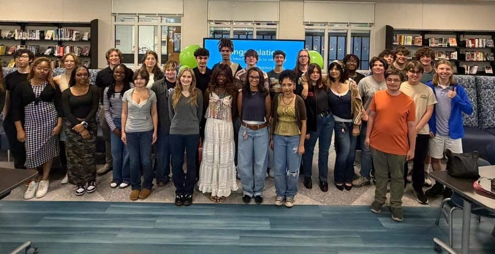 AP Honors students group photo in the library after breakfast