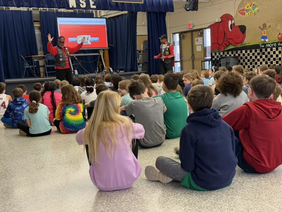 students sitting watching  presentation