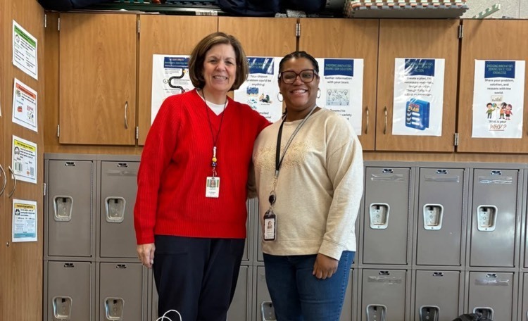 Civic South volunteer delivering donations to Miss Davis.