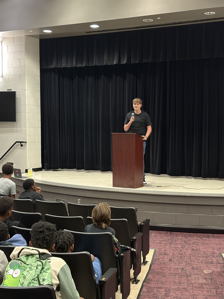 Wyatt Kyker giving his SGA speech in the WMS auditorium.