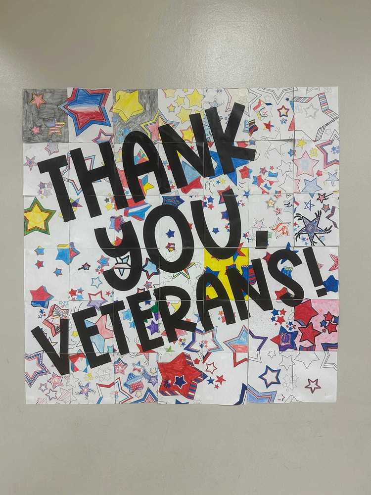 A colorful 'Thank You Veterans' sign decorated by Rolling Hills Elementary School students,