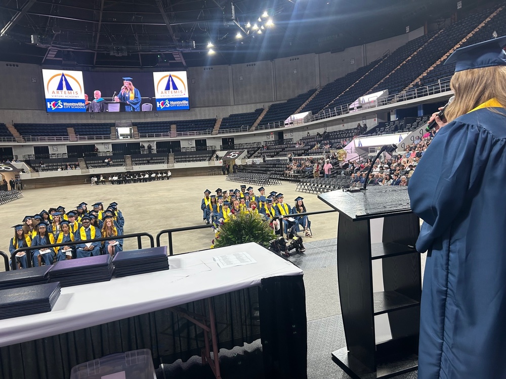Student addresses her classmates during the graduation ceremony.